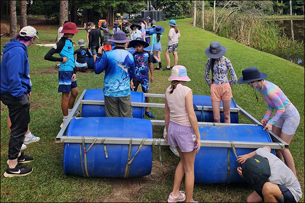 Year 6 students with boats
